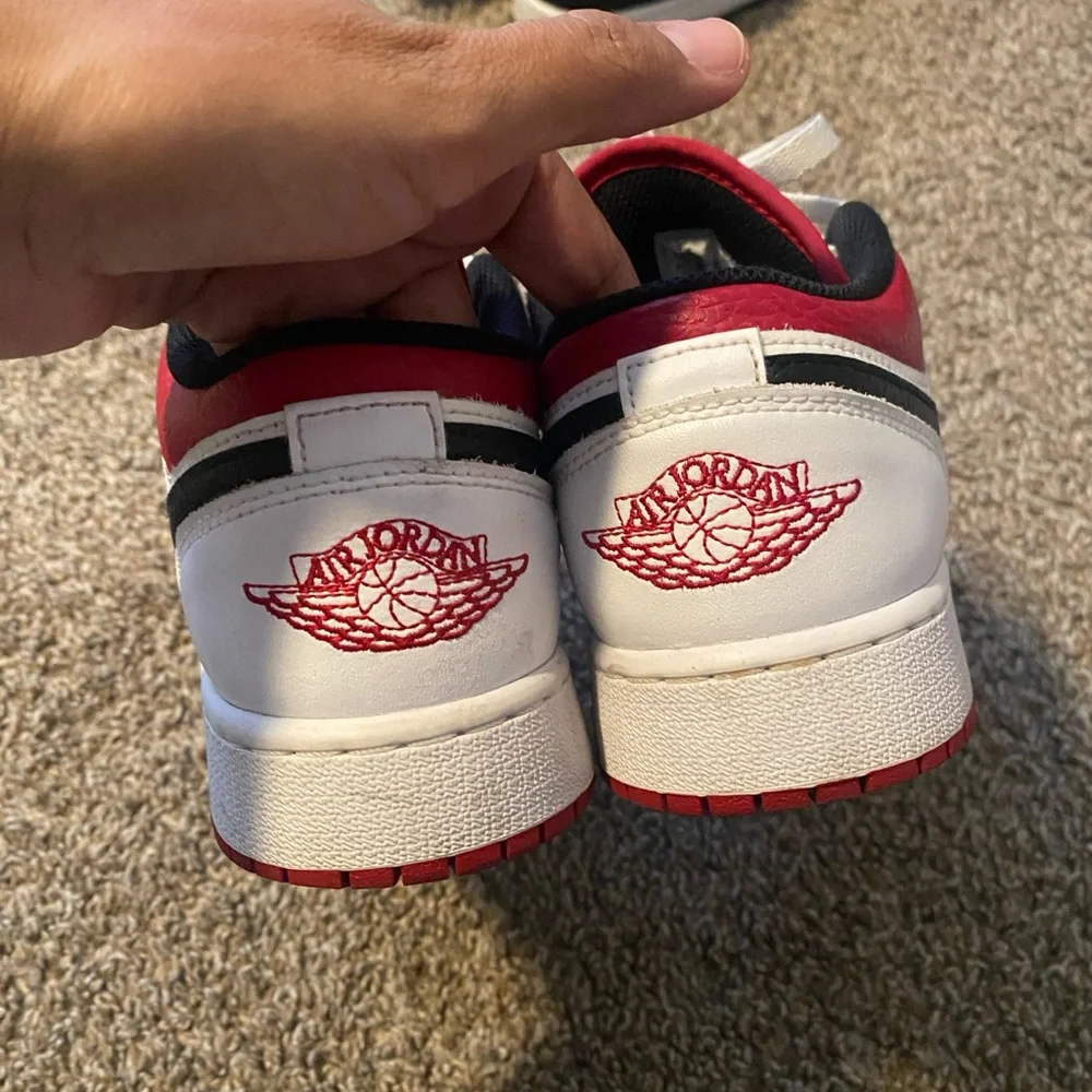 White and Red Sneakers with Black Logo